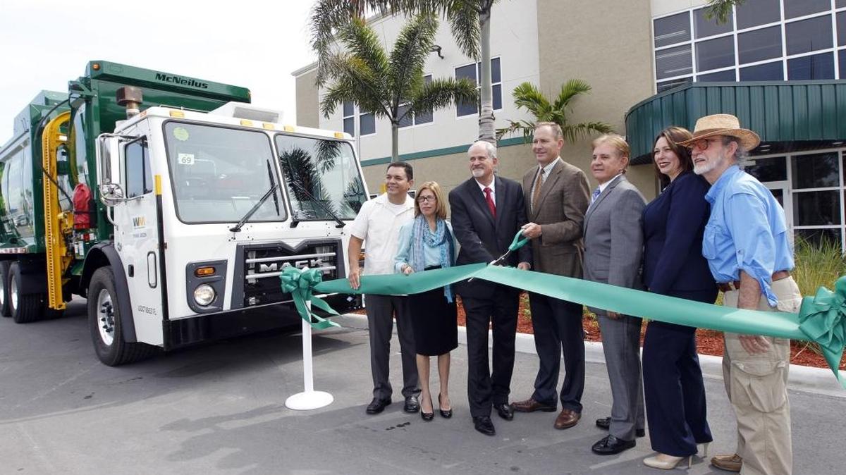 Cutting the ribbon on the the new Waste Management of Miami-Dade County facility in Medley are, from left: Medley Council members Edgar Ayala, and Griselia Digiacomo, Medley Mayor Roberto Martell, WM Florida Area Vice President Tim Hawkins, WM Government Relations Director Alex Gonzalez, Medley Councilwoman Susana Guasch and Medley Vice Mayor Jack Morrow.