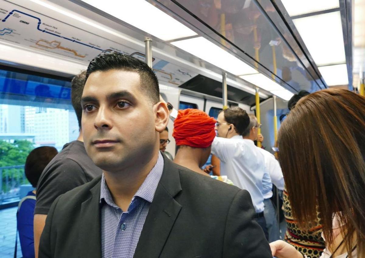 Miami-Dade Metrorail Transit commuter Jorge Bebelagua goes to work daily from Homestead to Downtown Miami using buses, Metrorail and Metromover on Thursday, October 12, 2017