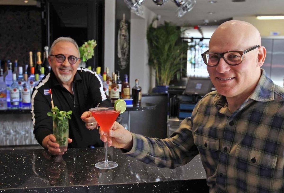 Developer Craig Robins, right, and music producer Emilio Estefan at Estefan Kitchen in Miami.