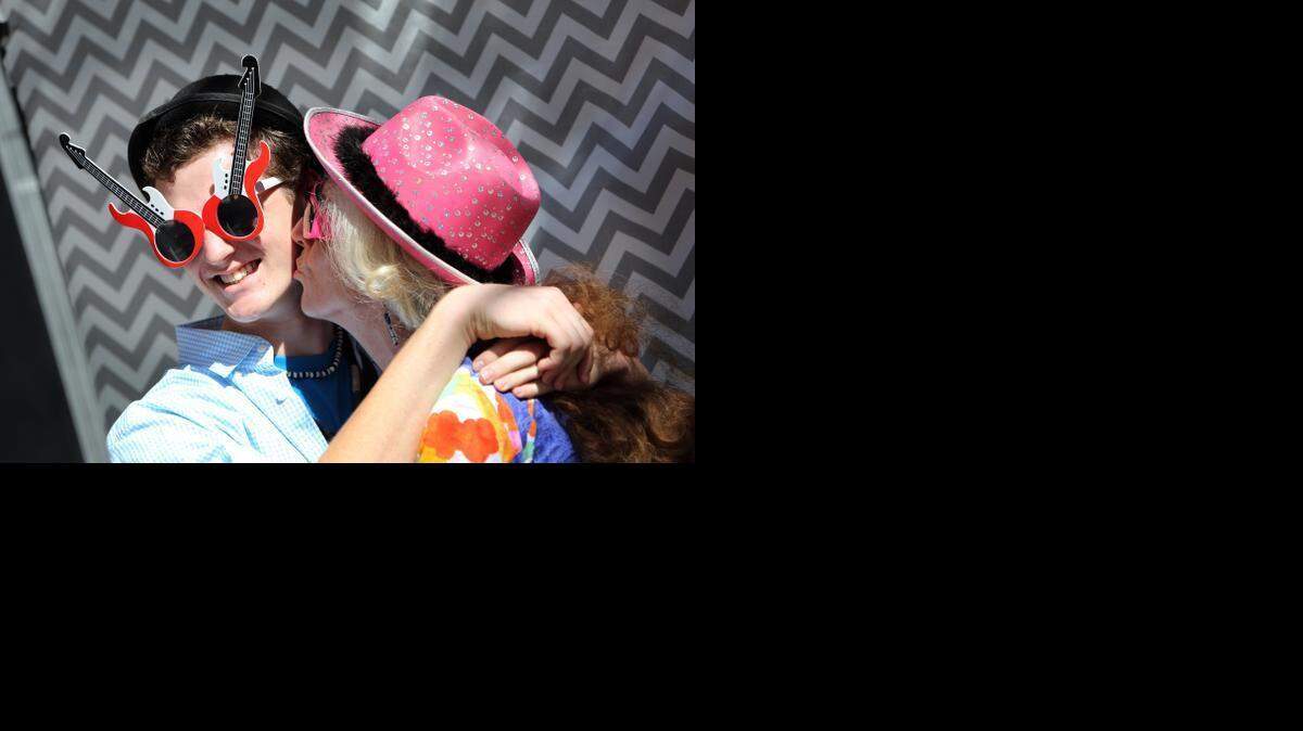 
Sixteen-year-old Dylan Knauer gets a kiss on the cheek, from his mom, Dianna Sherrill as the two take fun photos in a photo booth during the Miami Children's Hospital reunion party for cardiac patients and their heart doctors Monday, Feb. 16, 2015. Dr. Redmond Burke performed a very rare heart surgery on Dylan when he was just one-year-old. The PA Sling surgery that was performed has only been done 8 times ever in the world. Dylan came back to the hospital to meet Dr. Burke for the first time since the surgery 15 years ago.
