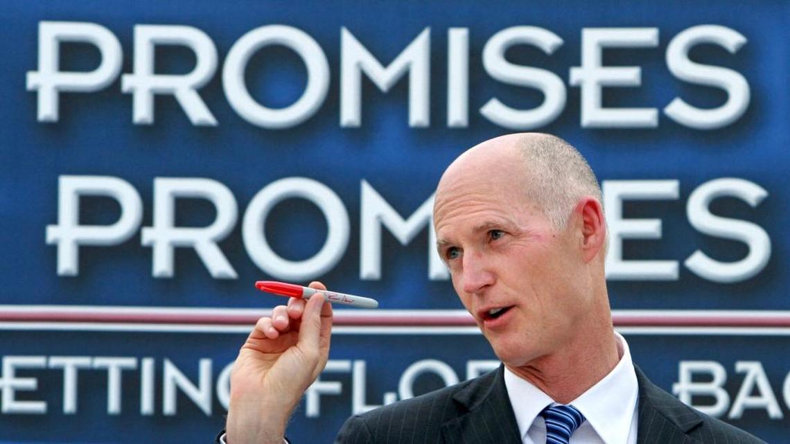 When Gov. Rick Scott signed his first budget in 2011, he made a show of holding up his red ‘veto’ pen to make a point during an outdoor ceremony in The Villages, Thursday, May 26, 2011. Soon he will sign his last budget as Florida’s governor. During his tenure, he has vetoed more than $2 billion in projects.