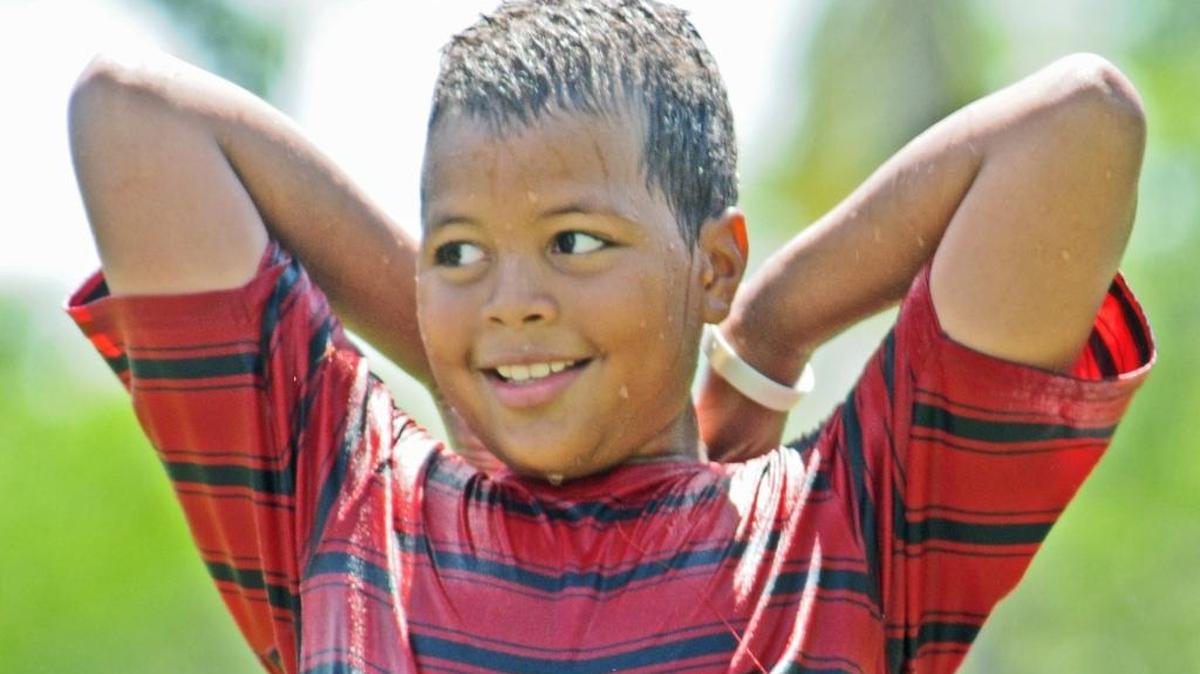 Angel Bouret, 11, takes a break from the heat at a City of Miami Parks & Recreation end of summer celebration in 2013.