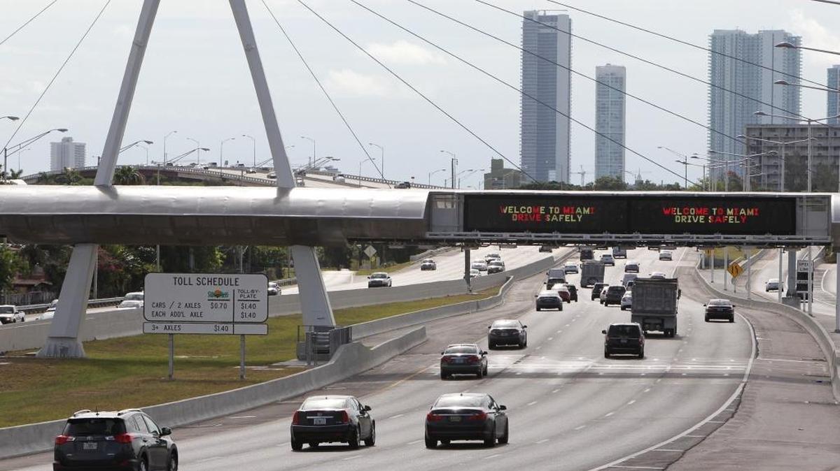 The toll taker on the eastbound 836 — Dolphin Expressway — approaching downtown Miami.