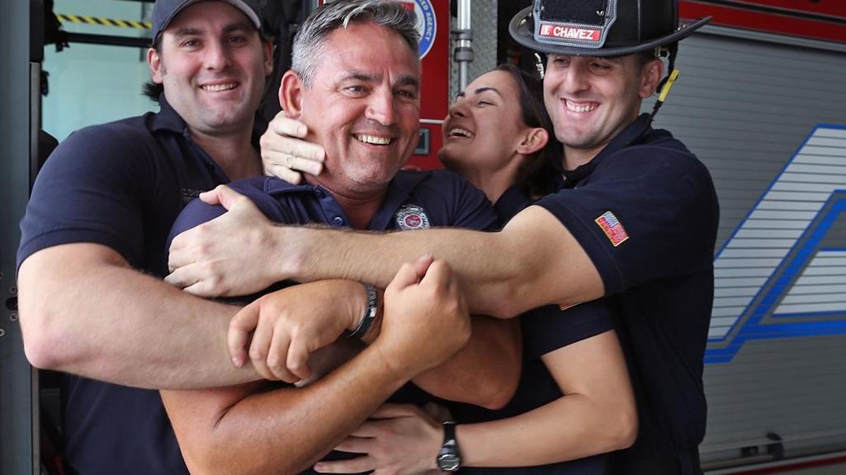 Ivan Chavez, a city of Miami firefighter who just returned from a military deployment, is photographed on Tuesday, June 13, 2017, with three of his children who are Miami Beach firefighters. Left to right: Christian Chavez, 29, Ivan Chavez, 53, Jasmine Chavez, 31, and Ivan Chavez Jr., 29.