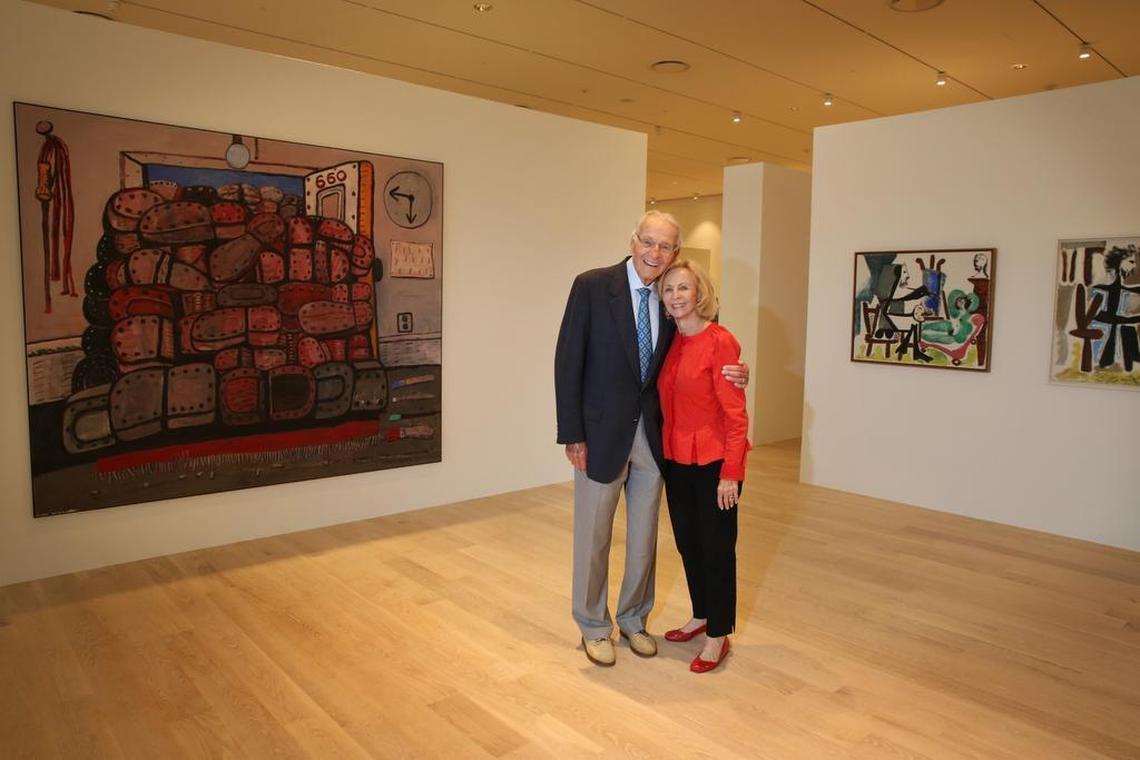 Norman and Irma Braman stand in a third-floor exhibit at the Institute for Contemporary Art in 2017. To the left is Philip Guston’s The Door. To the right is Pablo Picasso’s “Le peintre et son modèle” (The Painter and his Model).