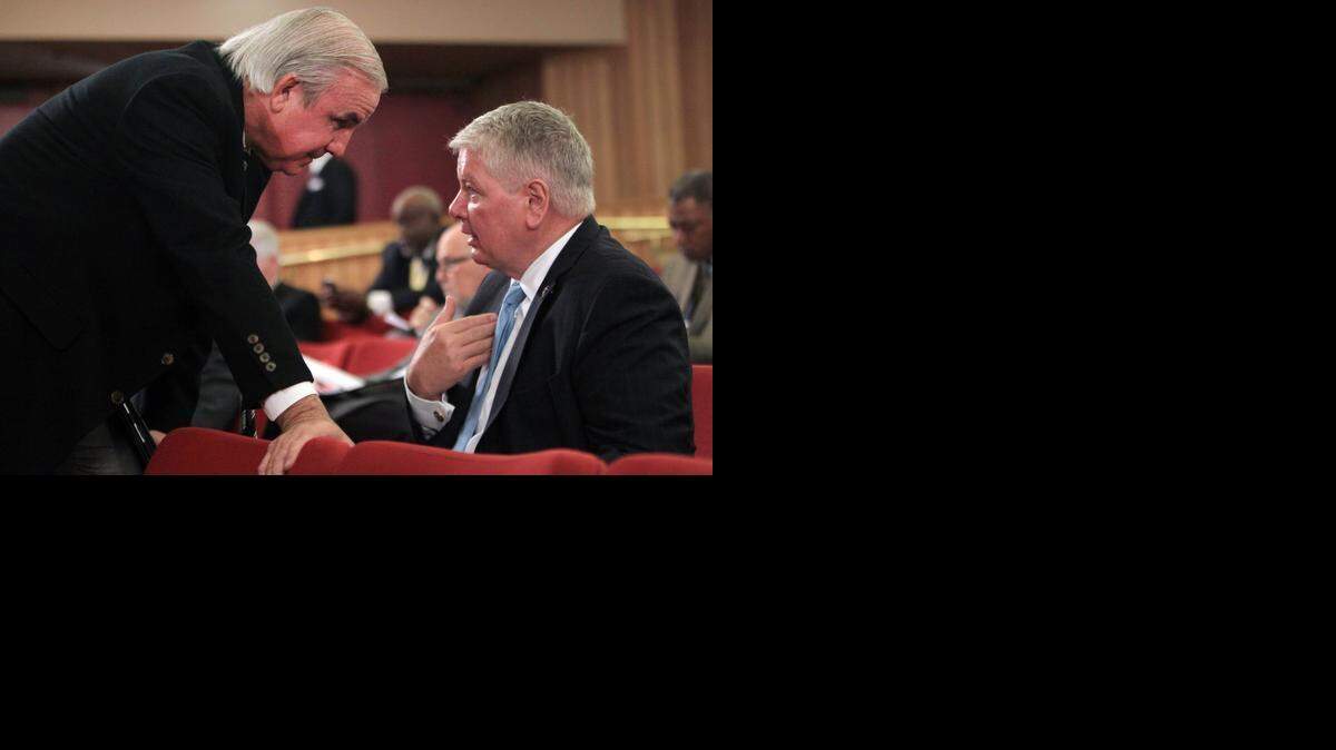 Carlos Gimenez, mayor of Miami-Dade County, talks with Port Director Bill Johnson at a January meeting of the County Commission.

