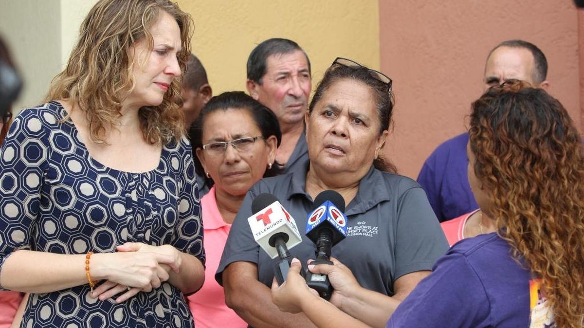 Maria Solis, a CBM employee for more than 17 years, speaks to the media outside the Sunset Place at Southwest 72nd Street and 57th Avenue in September 2015.