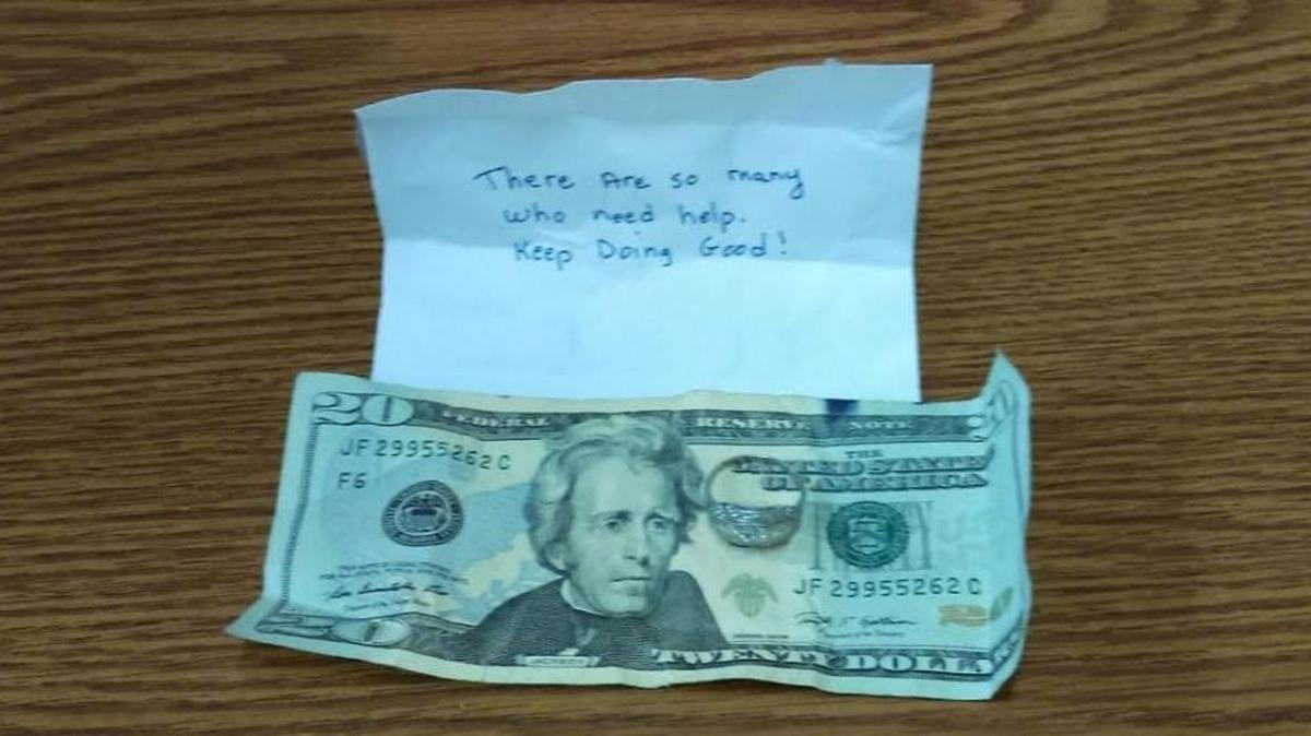 The Salvation Army found a diamond ring, valued at nearly $3,000, tucked inside this folded $20 bill with attached note, in a Red Kettle bucket at the Winn-Dixie supermarket in South Miami.