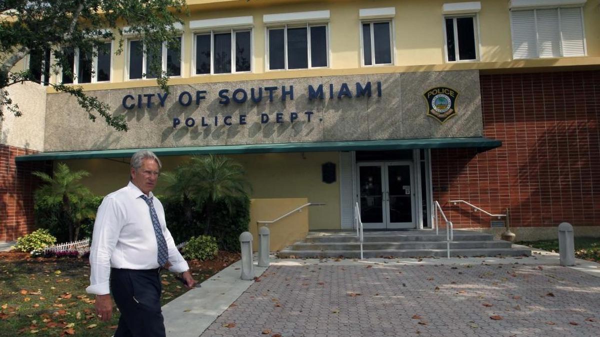 South Miami City Manager Steven Alexander walks in front of the South Miami Police Department in April.