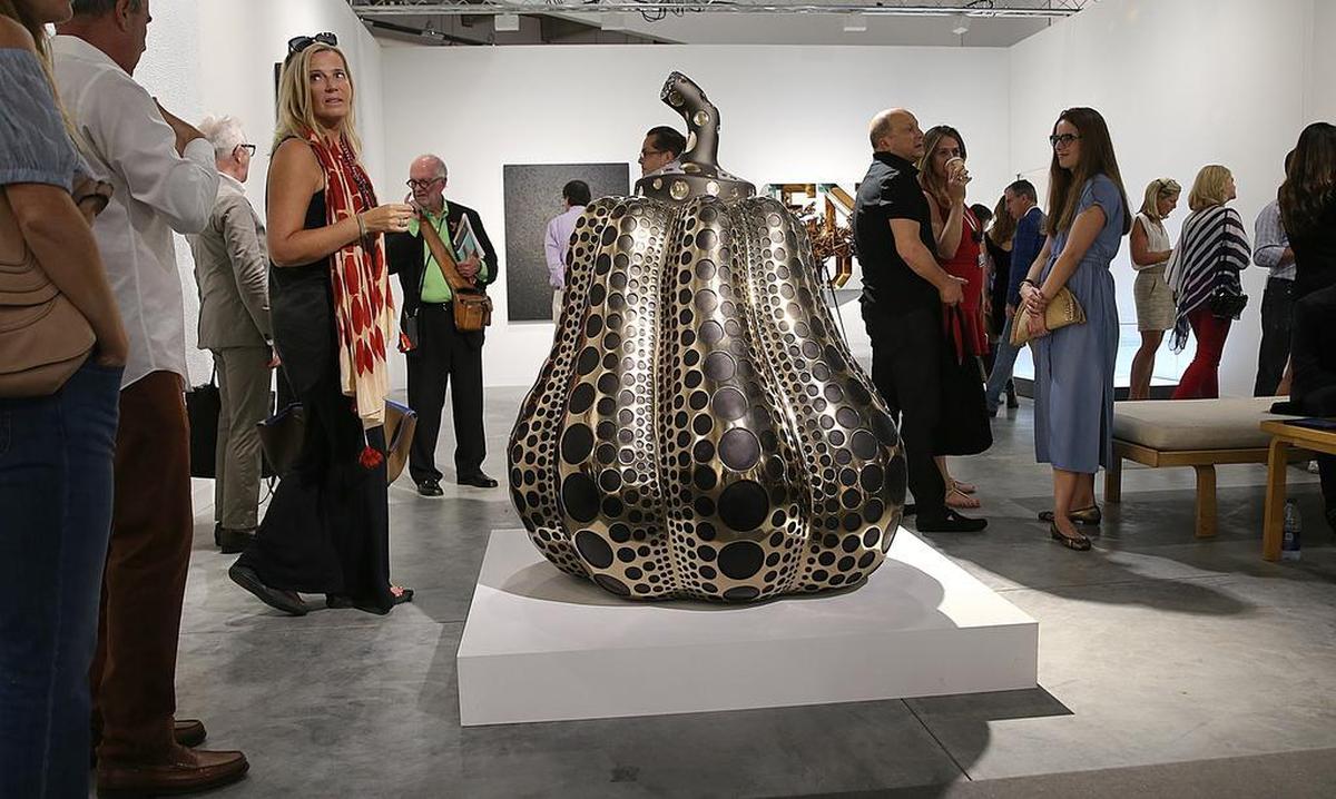 View of the piece Pumpkin, 2016, by artist Yayoi Kusama, on display at Victoria Miro Gallery, from London, during Art Basel's preview invitation-only event at the Miami Beach Convention Center in 2016.