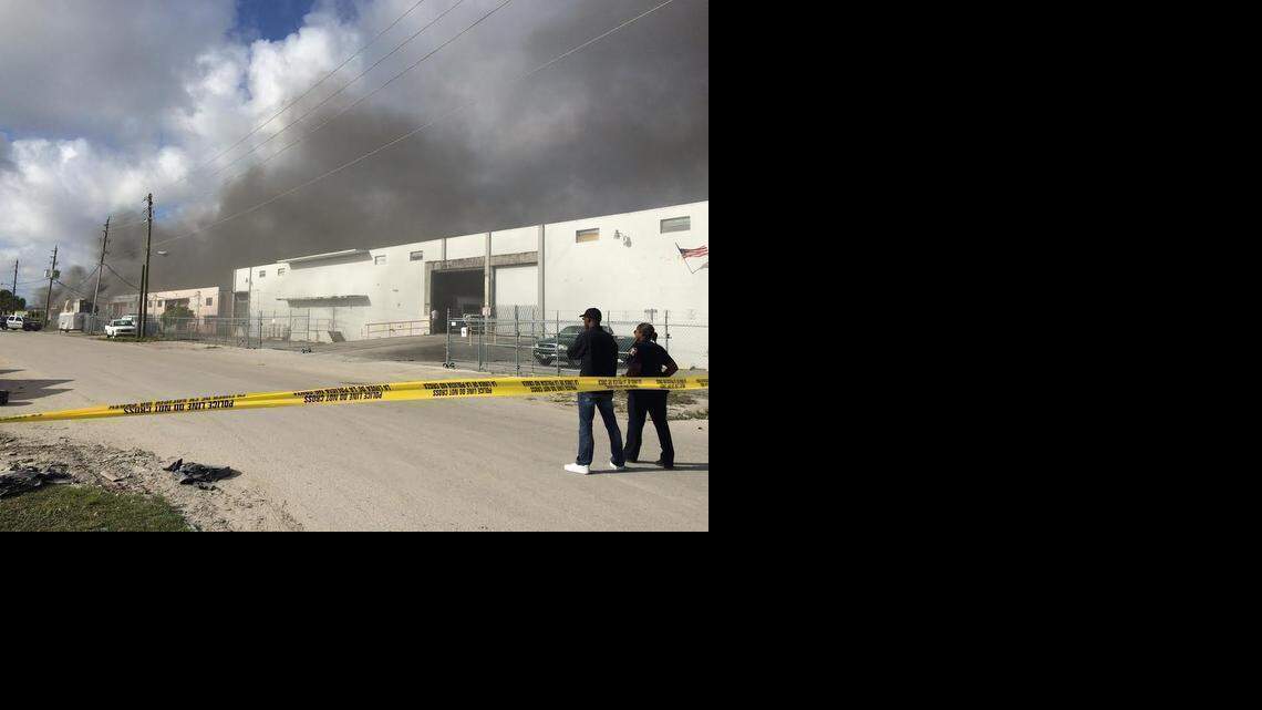 
A major warehouse send smoke into the air amid concern about the roof’s stability. 

