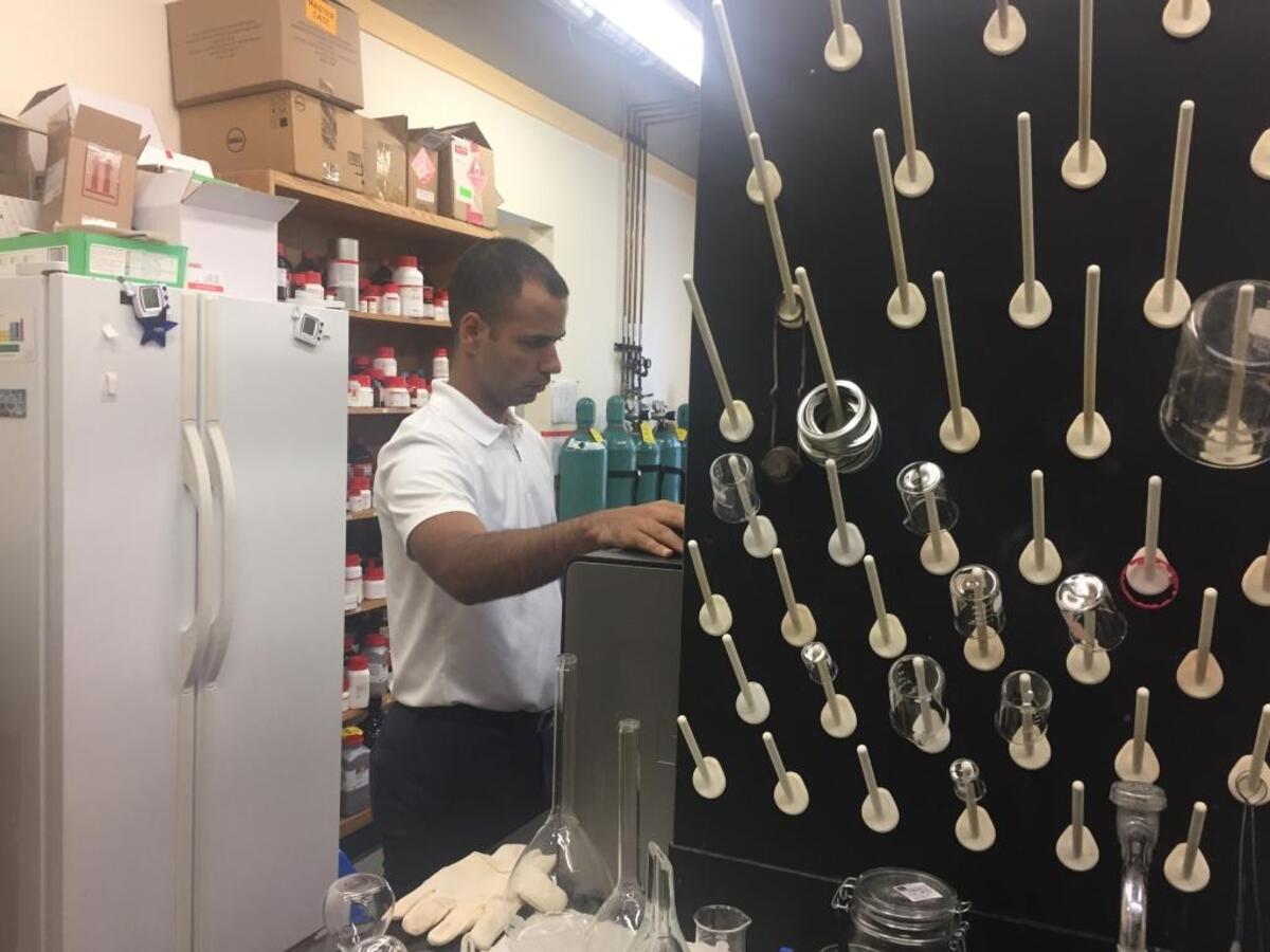 Ph.D. student Rodolfo Mesa analyzes chemical compound levels extracted through FPSE.
