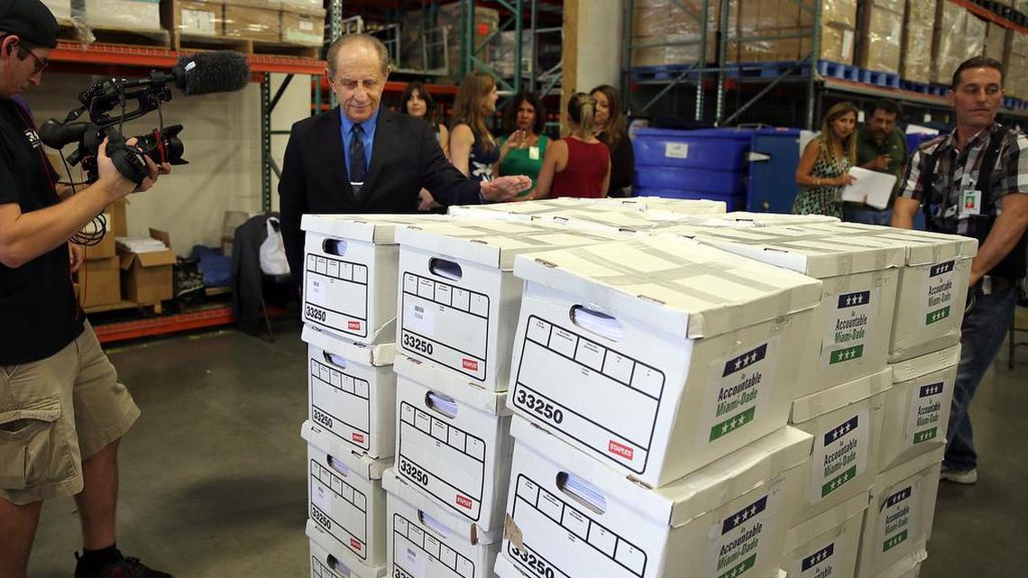 Miami-Dade County Clerk of Courts Harvey Ruvin, supervises the delivery on Aug. 2 of almost 130,000 signed petitions to put a campaign finance measure on the November ballot. The County Commission on Monday ordered that the signatures be counted.