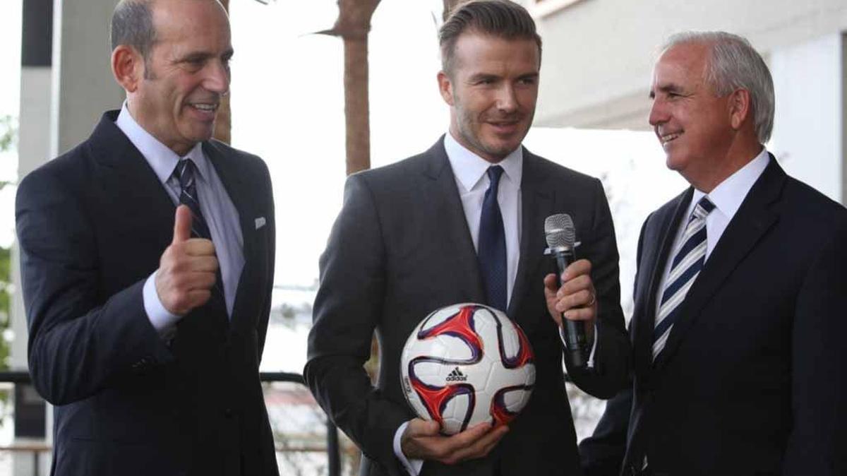 
A deal that’s been a long time coming: this file photo from Feb. 5, 2014 shows Major League Soccer Commissioner Don Garber, David Beckham and Miami-Dade Carlos Gimenez celebrating Beckham’s selection of Miami as the home to his future soccer team. There still is no agreement to build a stadium for the team. 
