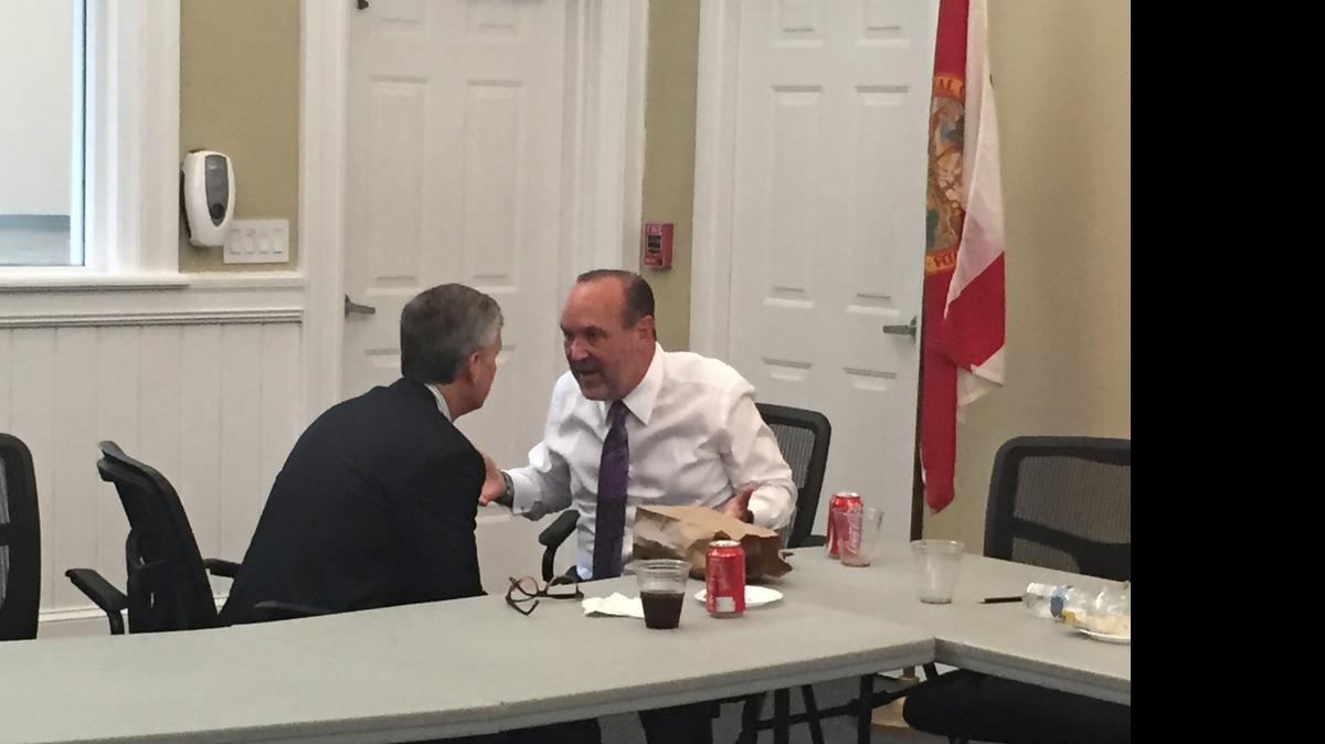 
A SOMBER MOMENT: Miami Commissioner Marc Sarnoff, left, listens as Miami-Dade Homeless Trust Chairman Ron Book apologizes following an emergency meeting of the Trust’s board at the Chapman Partnership North Center.
