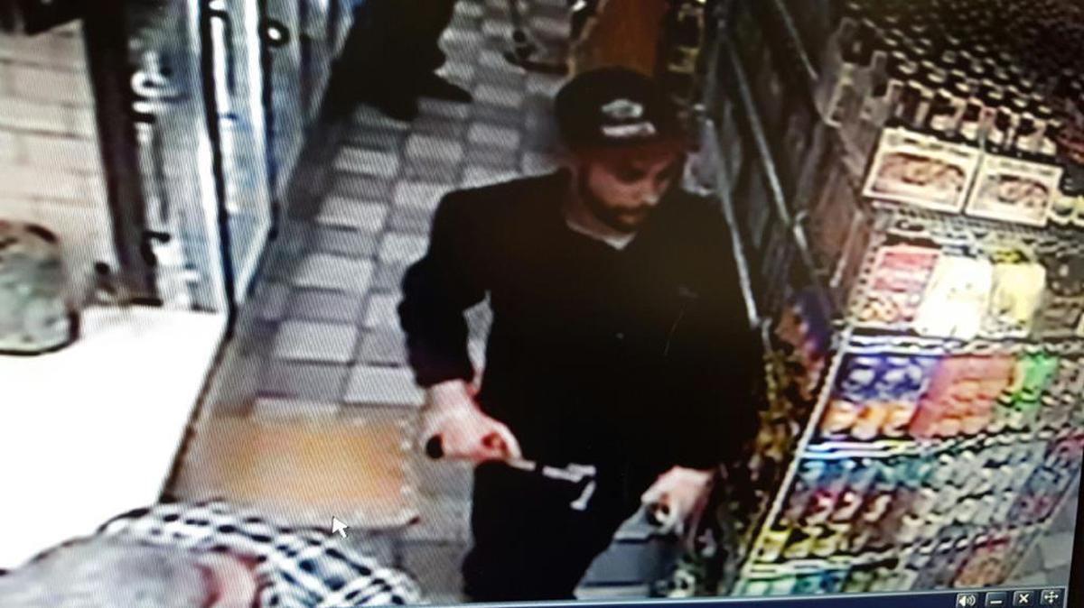 
CAUGHT ON TAPE: Miami Police on Thursday released surveillance pictures of a man who detectives say broke into two cars parked in the 3100-3200 block of Southwest 22nd Street and then used a stolen credit card at a nearby police station.
