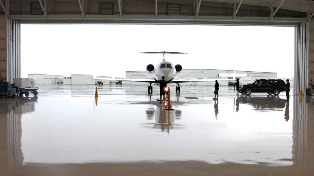 A private jet taxis into its hangar at Turnberry’s terminal facility at the Opa-Locka Executive Airport.