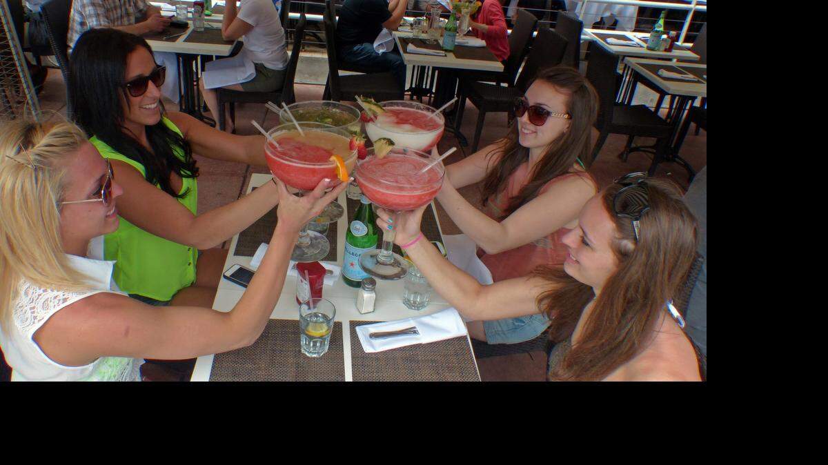 
Megan Cockroft, (lower left, then clockwise) Jordyn Fisher, Kaitlyn Galati and Alli Boettinger, all from Montclair State University in New Jersey, enjoying drinks along Ocean Drive during spring break 2013.
