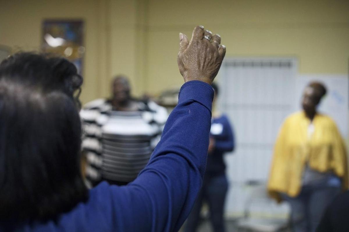 Vivian Tutt, 79, leads a protest song during a Women’s Circle gathering at the Miami Workers Center.