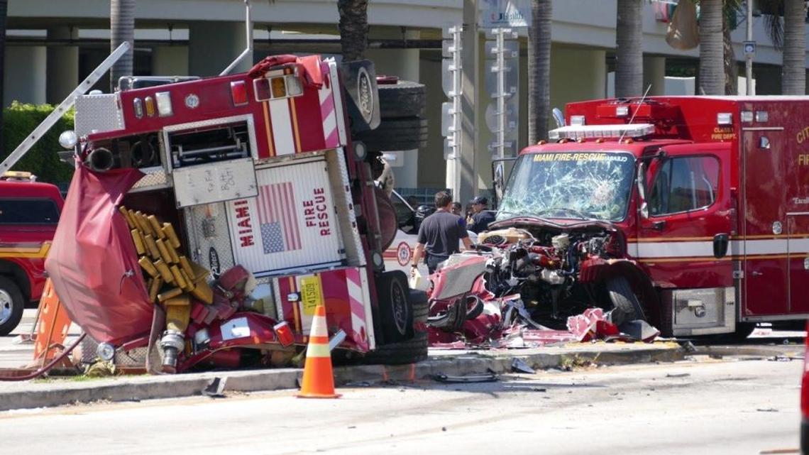 Officers and rescue personnel work on the scene of a major crash involving two fire trucks in Miami. The crash happened Aug. 11 at Northwest 14th Street and 12th Avenue, near the Jackson Memorial Hospital complex, as both vehicles were rushing to a call.
