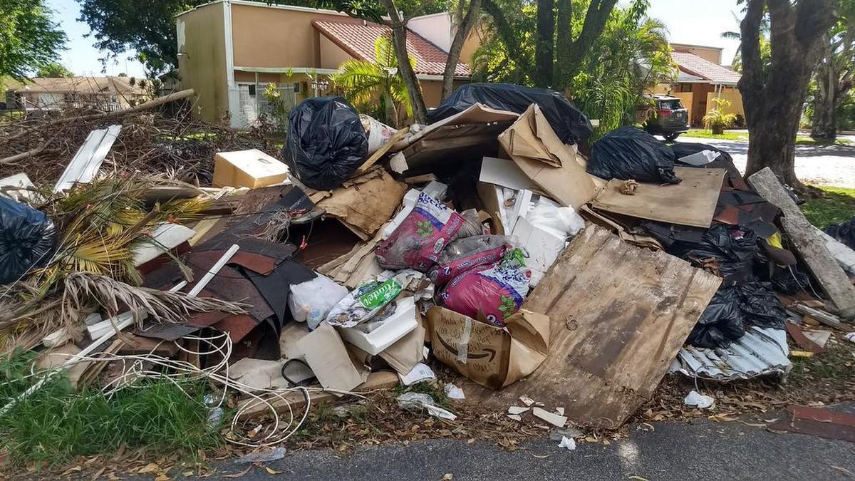 A pile of trash in the Greenway Lakes neighborhood in Southwest Miami-Dade. Pickup has been delayed because Miami-Dade County is requiring associations on private roads to sign a waiver allowing them to pick up the trash.