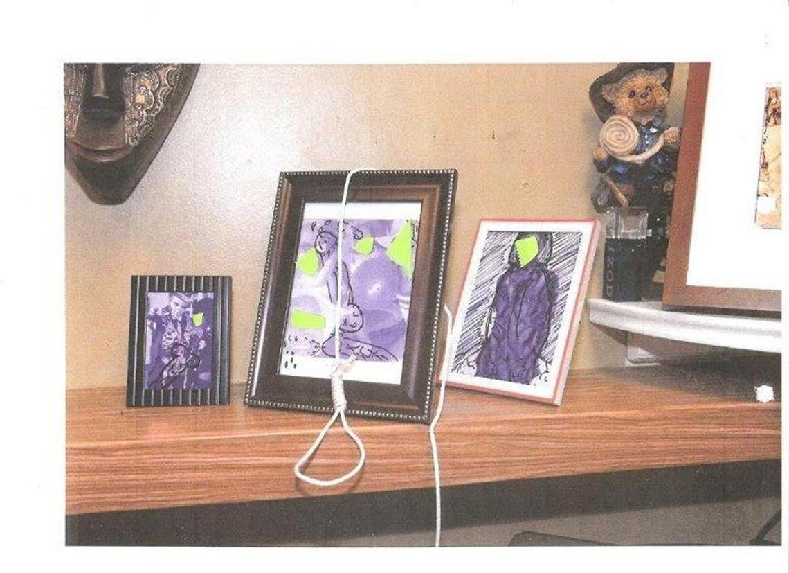 A photo taken in firefighter Robert S. Webster’s room at fire station 12 after he discovered penis drawings on his family photos and a noose placed over one of his picture frames.