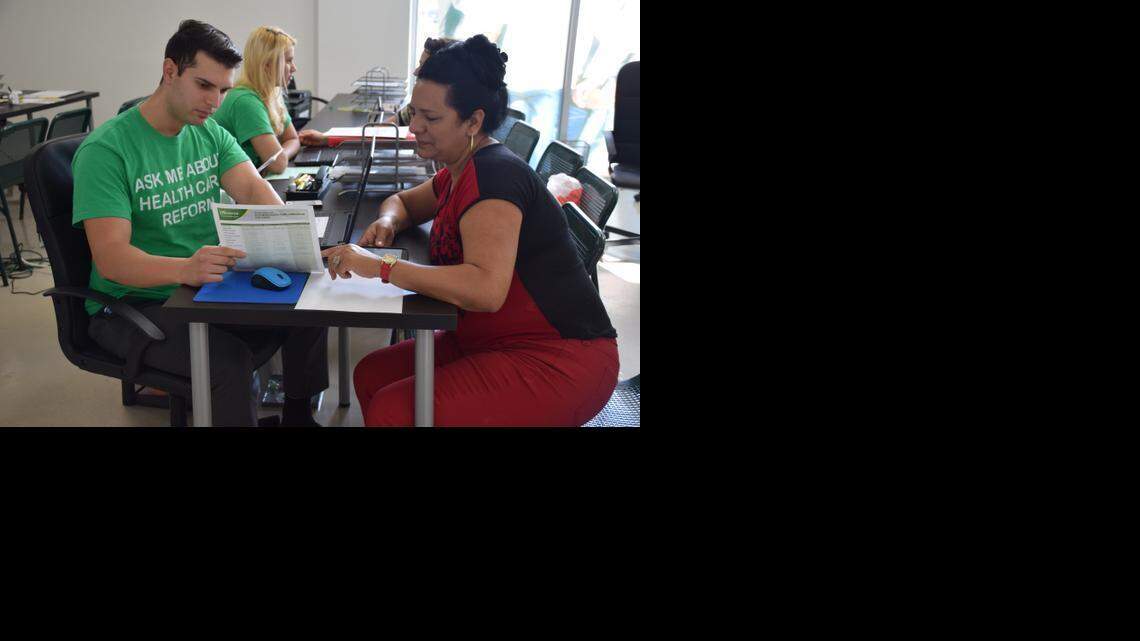 
 In one of Westland Mall’s two Sunshine Life & Health Adviser’s offices, enrollment counselor Daryll Garcia, 27, helps 49-year-old Yuritza Fons sign up for Obamacare for the first time. The 33012 ZIP code in which the agency is located ranked first in the nation for most Obamacare enrollments. 
