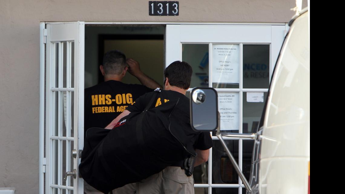 
Federal agents enter Palmetto Comprehensive Healthcare, at 1313 SW First Street in Miami, as part of a major Medicare fraud bust on Thursday.
