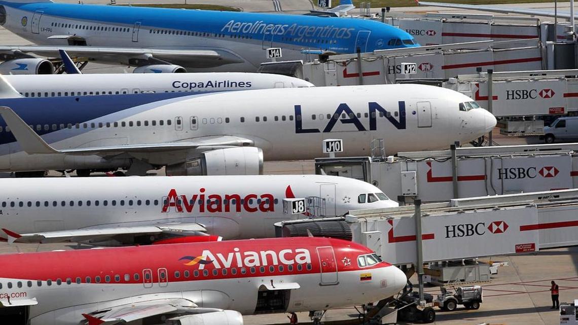 
Planes line up on the north side of Concourse J at Miami International Airport on Thursday, Aug. 13, 2015, during the unveiling of a project that will install brighter, energy-efficient lighting, water conservation retrofits, air-conditioning and ventilation upgrades and other green initiatives at that will save the airport more than $40 million over 14 years.

