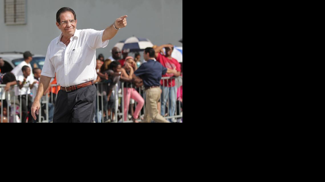 
County Commissioner Xavier Suarez points to the crowd during the 2013 Martin Luther King Jr. parade in Miami.
