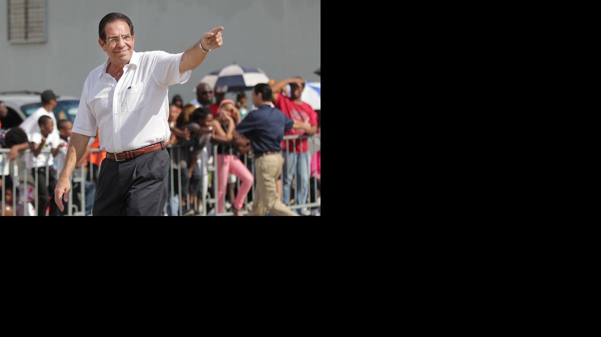 
County Commissioner Xavier Suarez points to the crowd during the 2013 Martin Luther King Jr. parade in Miami.
