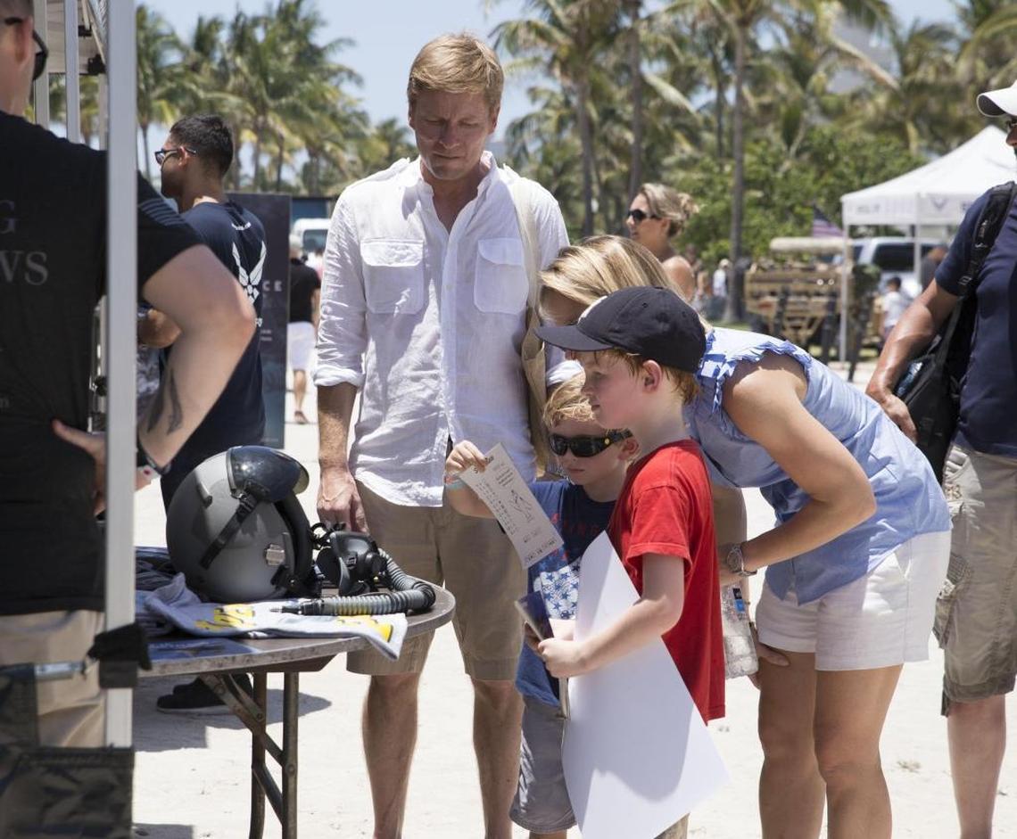 From left, Michael Ledul, August Ledul, Evelyn Ledul and Edgar Ledul look at Air Force equipment during the Memorial Day Weekend Air and Sea Show at Miami Beach on Saturday, May 27, 2017.