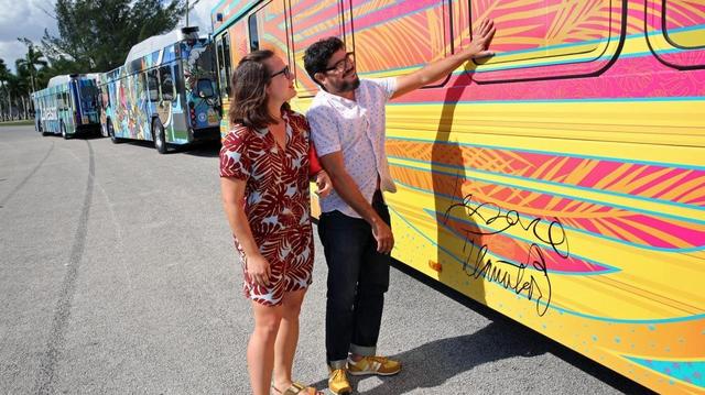 Winning artists Natalie Zlamalova and Laz Ojalde view the artwork on the bus they both designed for the Miami-Dade Department of Transportation and Public Works. Five buses were unveiled for their winning design from the Transit Loves the Arts contest. Over 100 entries from local artists were submitted, with five winners and 10 finalists picked. The five winning buses hit the roads on Wednesday, Nov. 2, 2016
