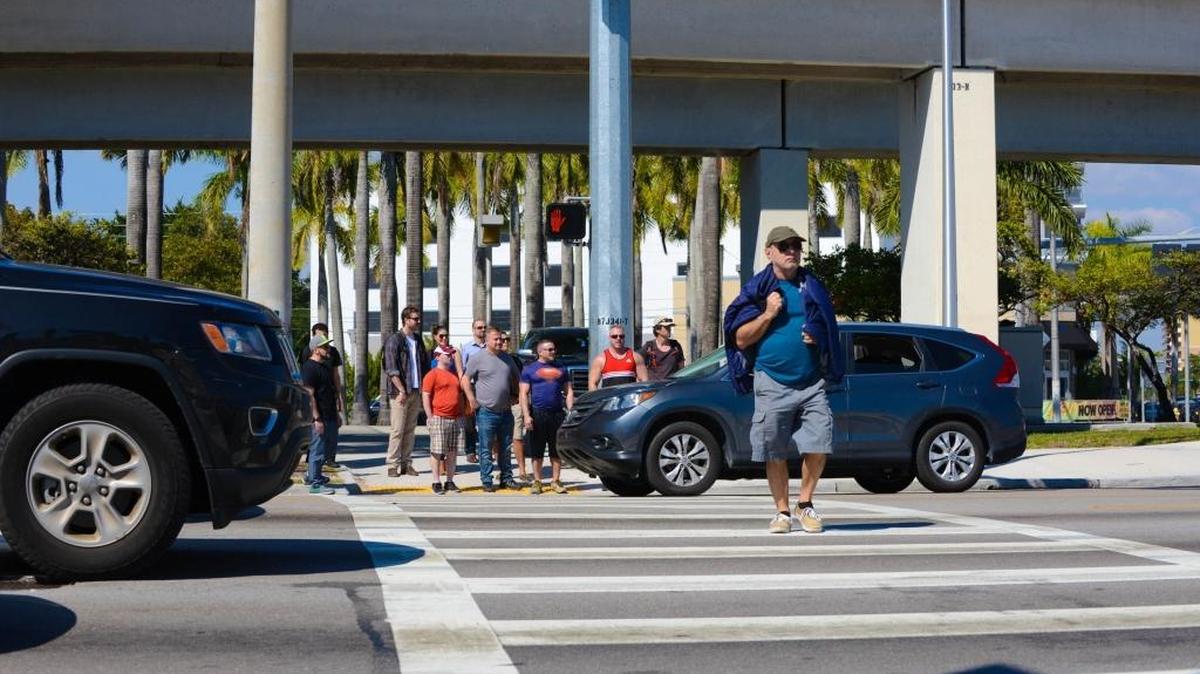 A pedestrian crosses the street at U.S. 1 and Southwest 27th Avenue in this file photo. Farther south down the highway, Miami-Dade plans a pedestrian overpass.