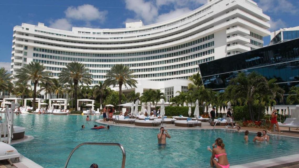 According to a police report, officers found the victim in a Fontainebleau Hotel room with a swollen eye and red throat.