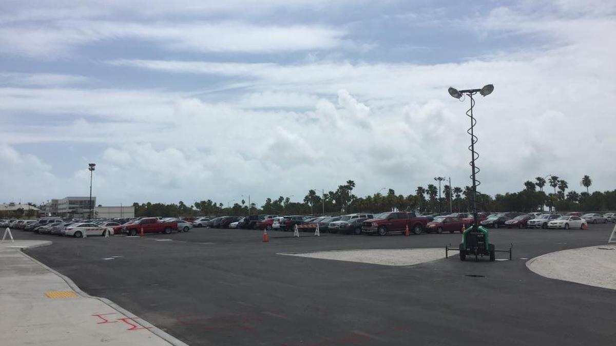 Miami officials promised to roll astro turf over the eastern portion of the Marine Stadium campus by March 17. This picture, taken March 24, shows the area as parking for the Miami Open.