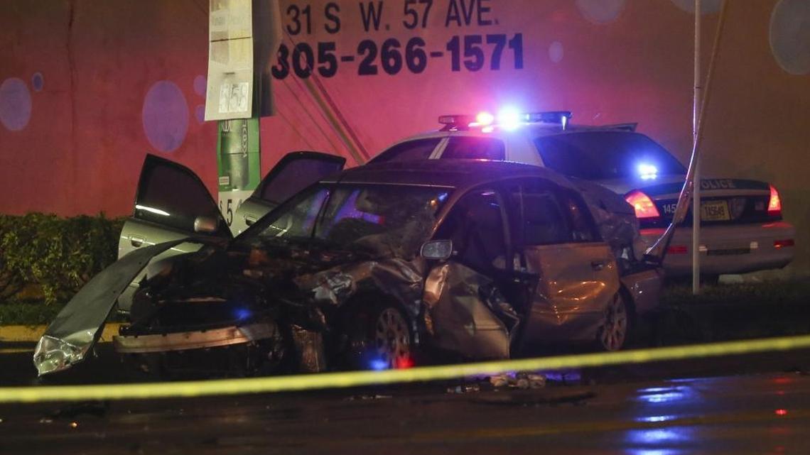 Miami-Dade police investigate a car accident on Thursday, Oct. 6, 2016, on Flagler Street and Northwest 57th Avenue. Two vehicles, a police 2010 Dodge Charger and a 2007 Audi A4, were involved in the accident, which injured nine people, including several children.