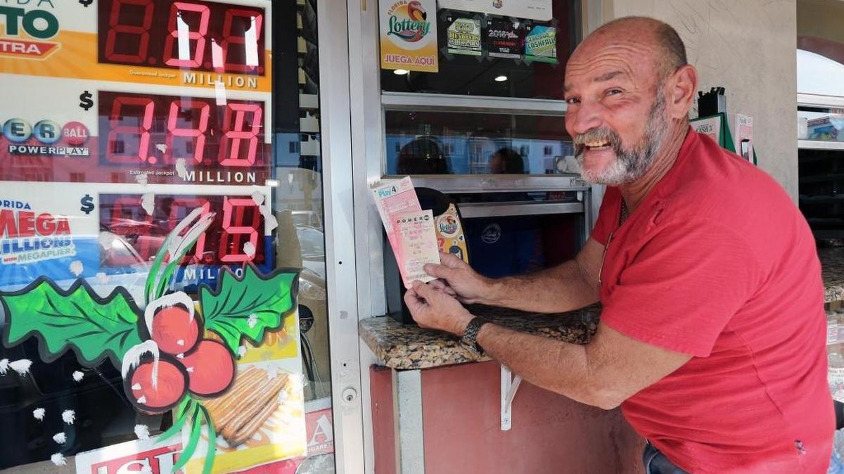 Marcelo Ortega purchases Powerball tickets on Monday at Caribe Restaurant and Market on Northwest 39th Avenue and Seventh Street in Miami. The Powerball jackpot prize has grown to $1.4 billion.
