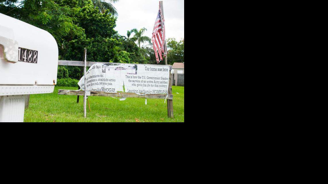 
A sign stands at 1488 NW 103rd St. in Miami to let passers-by know the government demolished the house even though the owner was on active military duty.
