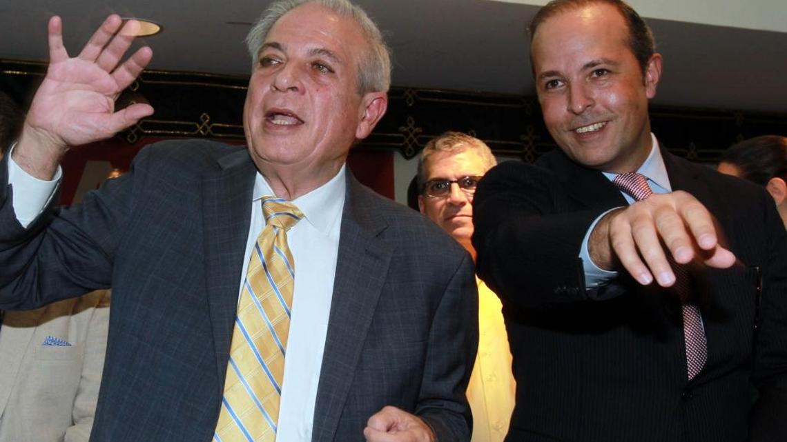 Mayor Tomás Regalado and his son, Tommy Regalado, at the mayor’s reelection party in 2013.