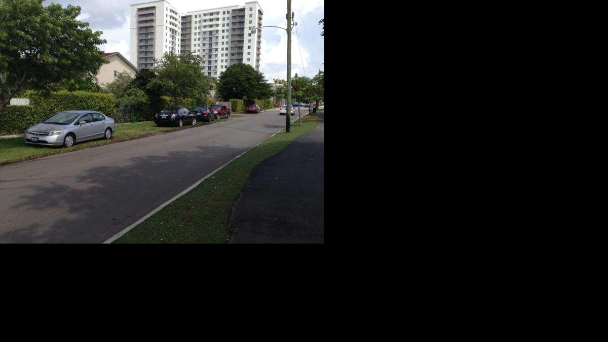 
109 Tower tenants are required to park at FIU, across Southwest Eighth Street, because the building has only 25 spaces for 500 bedrooms. Instead, some choose to leave their cars parked illegally on the grassy right-of-way in the city of Sweetwater.
