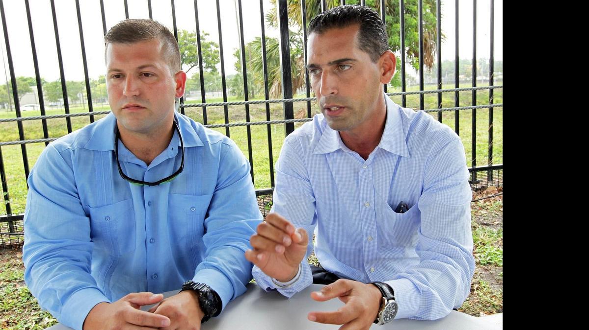 
Dismissed Sweetwater police officer Ernesto Barquín (left) and Ihosvany Gárciga said they were unjustly fired and are seeking to be reinstated.
