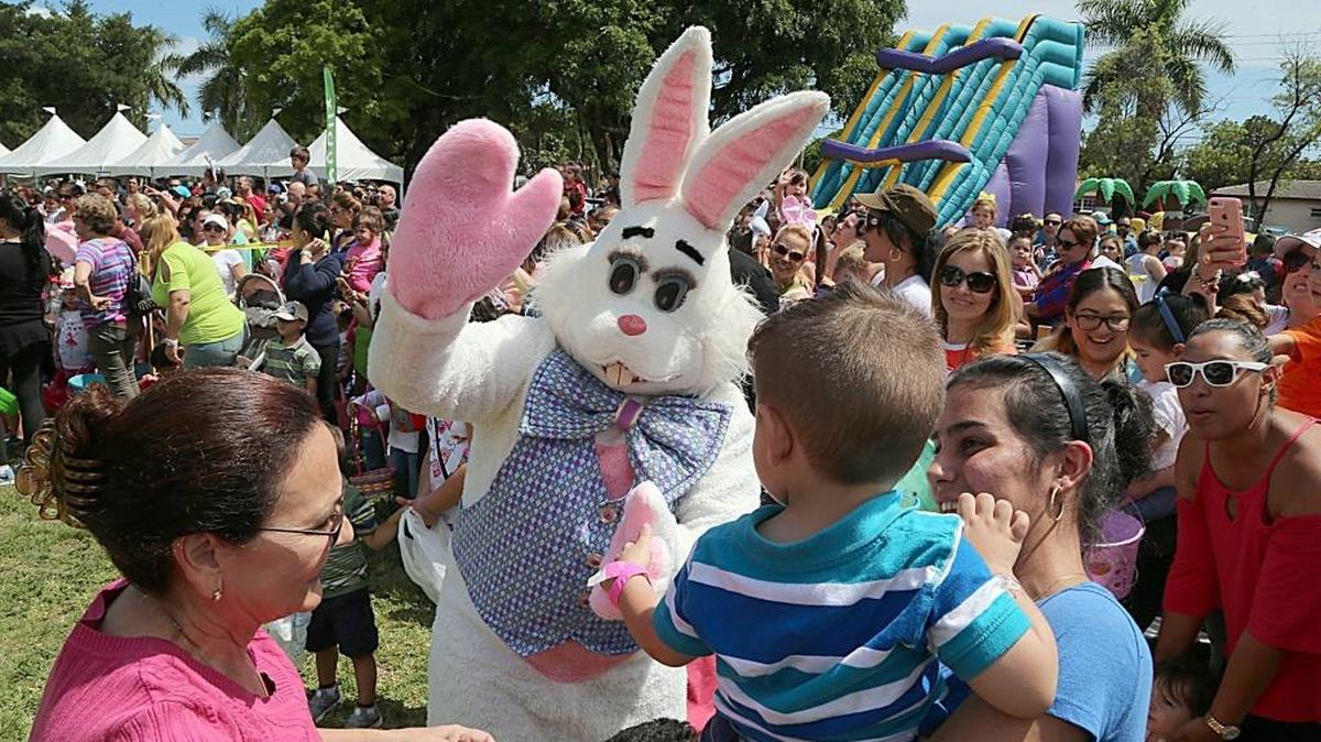 The Easter bunny greets kids and families during the city of West Miami 70th anniversary party celebrated at Cooper Park in West Miami on Saturday, April 8, 2017.