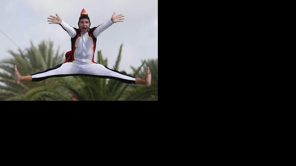 
Jordan Harris practices for the Olympic Penguin High Dive before the opening of the Miami-Dade County Fair and Exposition on Wednesday, March 11, 2015.
