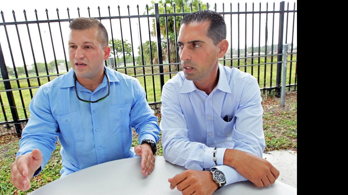 
Sweetwater police officers Ernesto Barquin and Ihosvany Garciga speak June 5 to an el Nuevo Herald reporter after they were fired by the police department.
