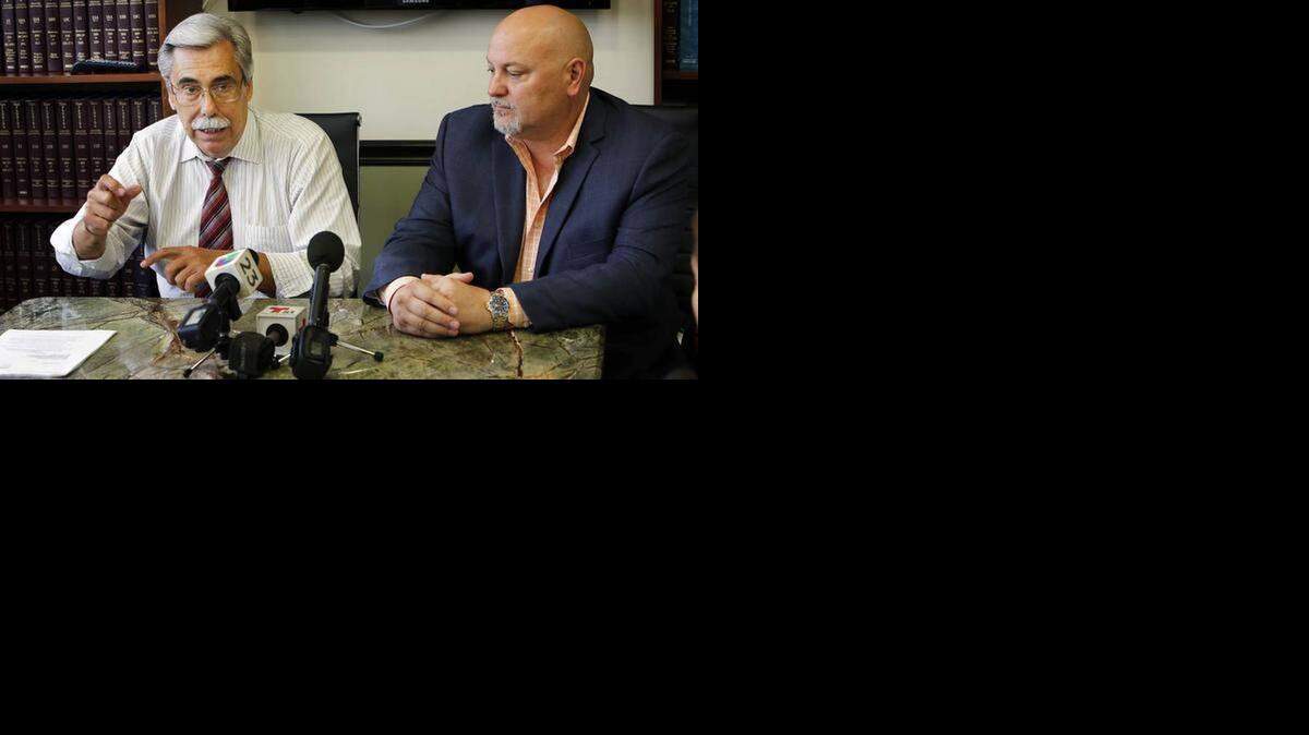 
Orlando López (right), a mayoral candidate in Sweetwater, next to his lawyer José M. Herrera during a press conference in Herrera’s office on Thursday, April 2.

