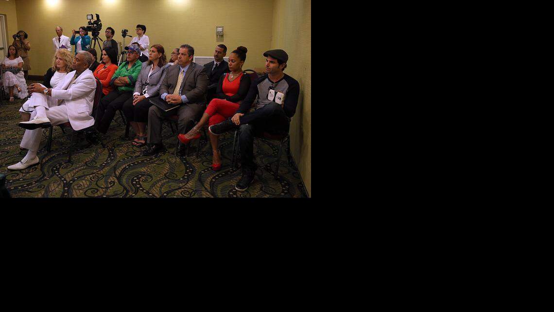 
Santeria followers listen as religious leaders, or babalawos, present ‘la letra,’ or letter — a set of predictions and advice guiding worshipers for the new year, at the Ramada Hotel in Hialeah on Friday, Jan. 2, 2015.
