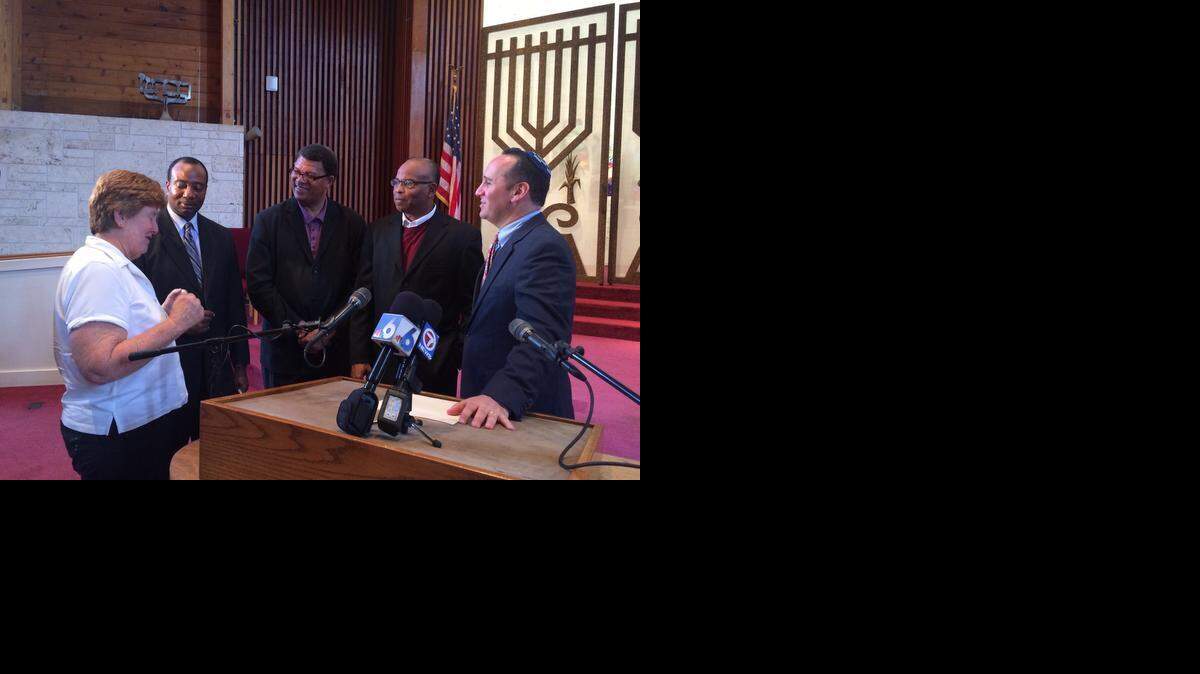 
Religious leaders gather Thursday at Temple Sinai to increase dialogue across communities. Rabbi Alan Litwak is at right and the Rev. Richard Dunn is at center. The synagogue will have an interfaith service Friday.


