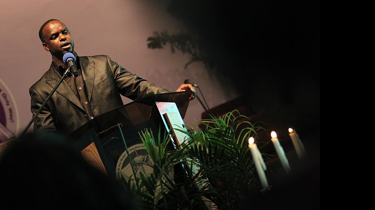 
Pastor Anthony Reed, who was born and raised in Charleston, speaks during a vigil at Martin Memorial AME Church in Richmond Heights to pray and mourn the victims of Wednesday's shooting at the historic black church Emanuel AME Church in Charleston, S.C. on Thursday June 18, 2015.
