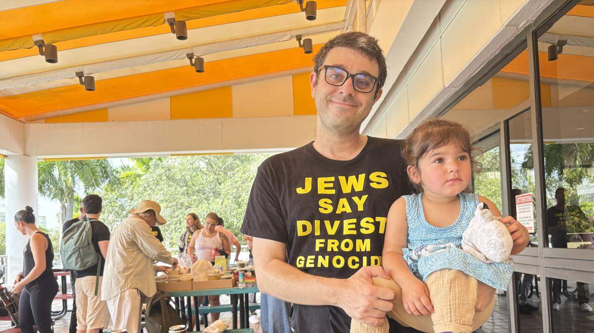 Ted Cava and daughter Leila pose at the Stephen P. Clark Center after an event on Thursday, Sept. 18, 2025, where speakers called on Miami-Dade County Mayor Daniella Levine Cava and other county leaders to back the county divesting of Israeli bonds. Levine Cava is Cava’s mother, and he said he feels so strongly about opposing Israel’s conduct in Gaza that he wanted to go public with his rift with his high-profile mother on that issue.